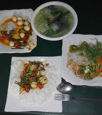 Common Myanmar dish, quail egg curry, rice, pasta salad, boiled greens