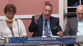 Town Councilor Brian Chandler makes a point during Forum