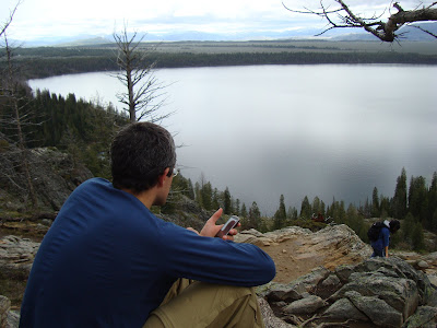 Chris checking his cell phone at Inspiration Point, overlooking Jenny Lake