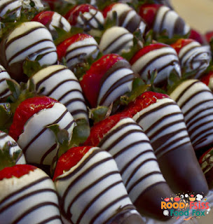Image of chocolate covered strawberries with milk chocolate drizzle.