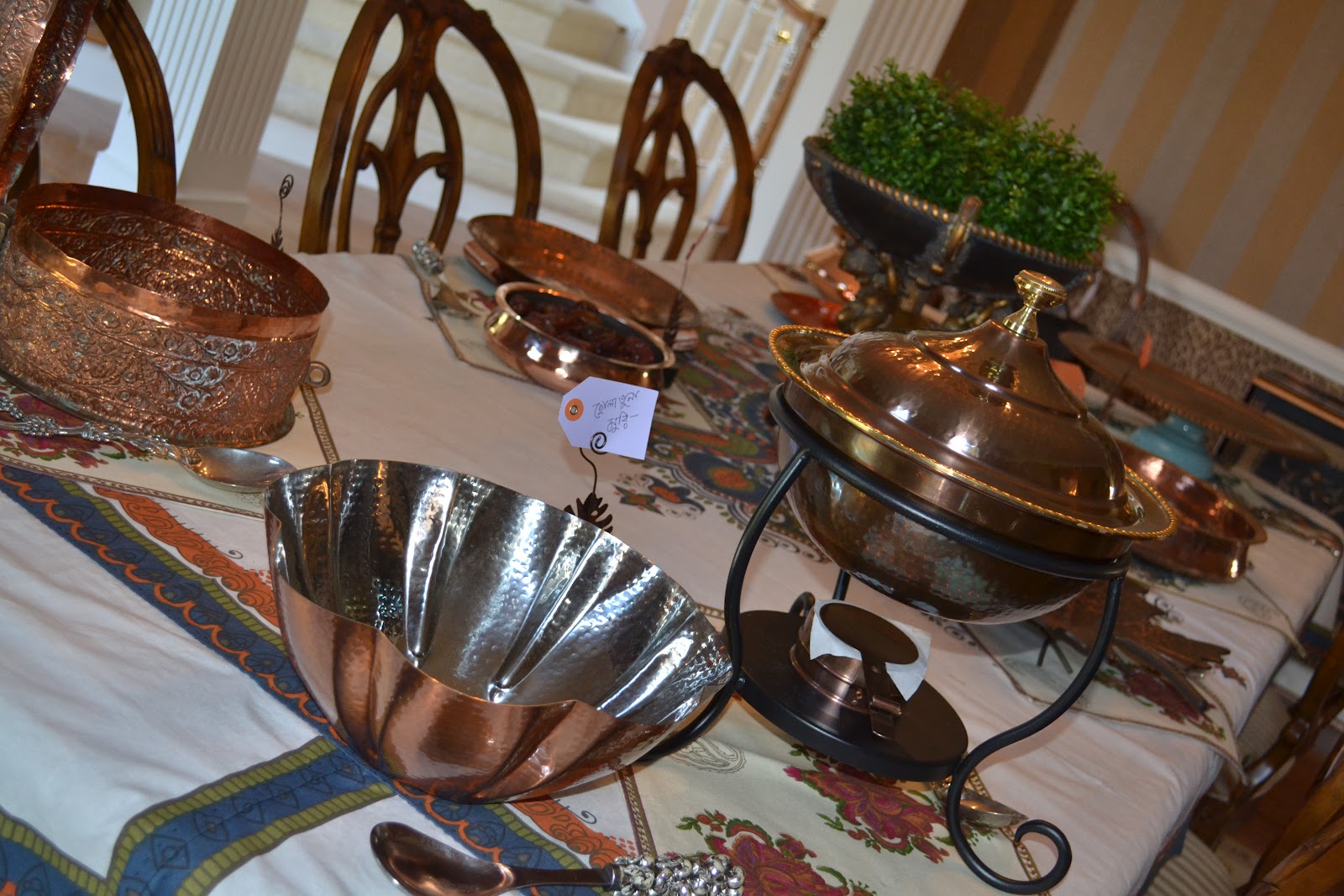 Set table with copper serving dishes...