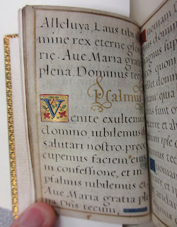 An open book with illuminated details.