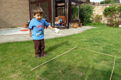 Child playing with bean bag