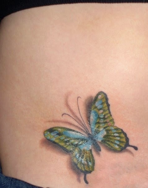 Colorful 3D butterfly tattoo on belly