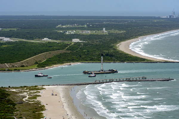 With the Falcon 9 rocket secured on its deck, the drone ship 'Of Course I Still Love You' enters the waterway at Port Canaveral in Florida...on June 2, 2020.