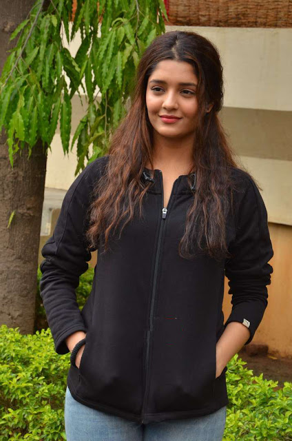 Ritika Singh exudes coolness in a black outfit, showcasing her stylish and confident demeanor.