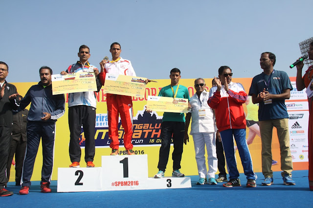 Winners at the podium (Full Marathon Elite Male): (L - R) SatyaBhan, Bahadur Dhoni and Hethram