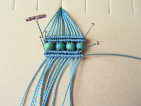 Straight pins and t-pins used to hold micro macrame by Sherri Stokey
