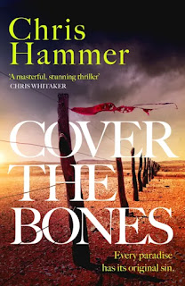 Cover for book "Cover the Bones" by Chris Hammer.  On arid land, a barbed wire fence on which is caught a ragged red cloth garment.