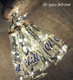 http://thespacebetweenblog.net/2012/06/28/diy-bottle-craft-chandelier/