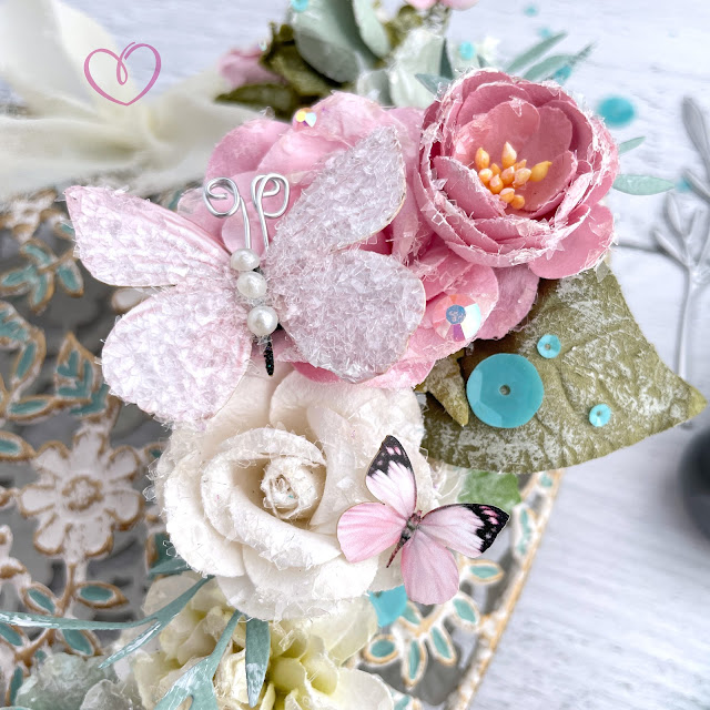 Altered shabby chic heart created with: Sizzix creamy matte acrylic pain in agave, multi-tool effectz, woodland stems die, muted cardstock, mint julep sequins mix; Prima avec amour paper flowers; Reneabouquets sweet pea butterfly kisses pink; Pinkfresh Studio jewels ballet slipper