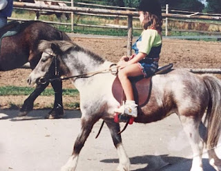 Childhood picture of Lisa Muller riding Haflinger horse