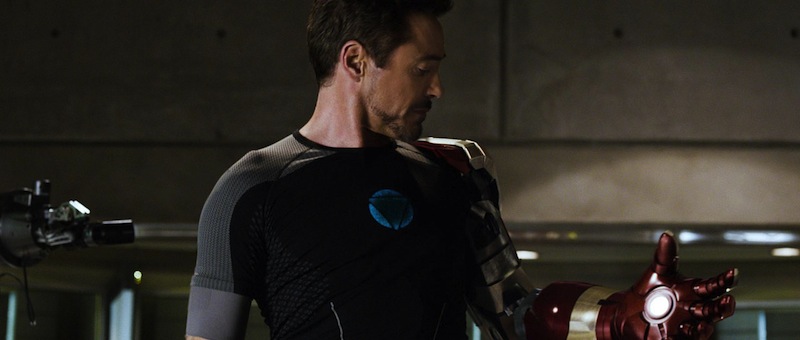 Tony Stark contemplating an Iron Man gauntlet