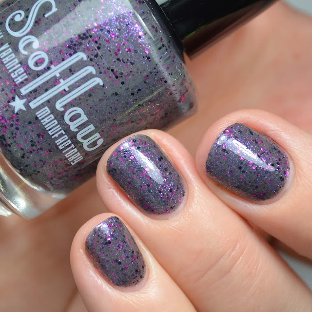 grey nail polish with purple glitter swatch