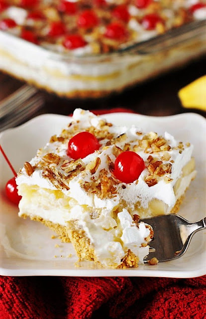 Fork Taking a Bite of No-Bake Banana Split Cake Image