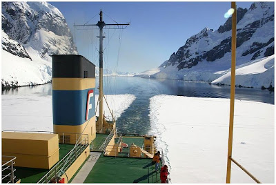 An ice-breaker moves in the Antartica waters