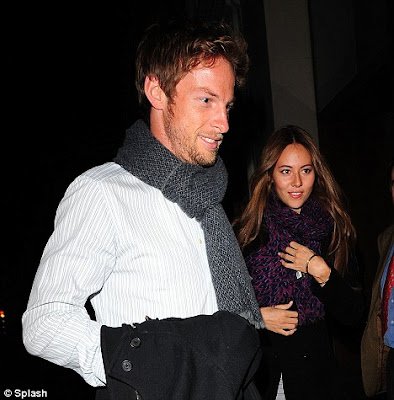 Looking hotter than ever model Jessica Michibata steered Jenson Button past 