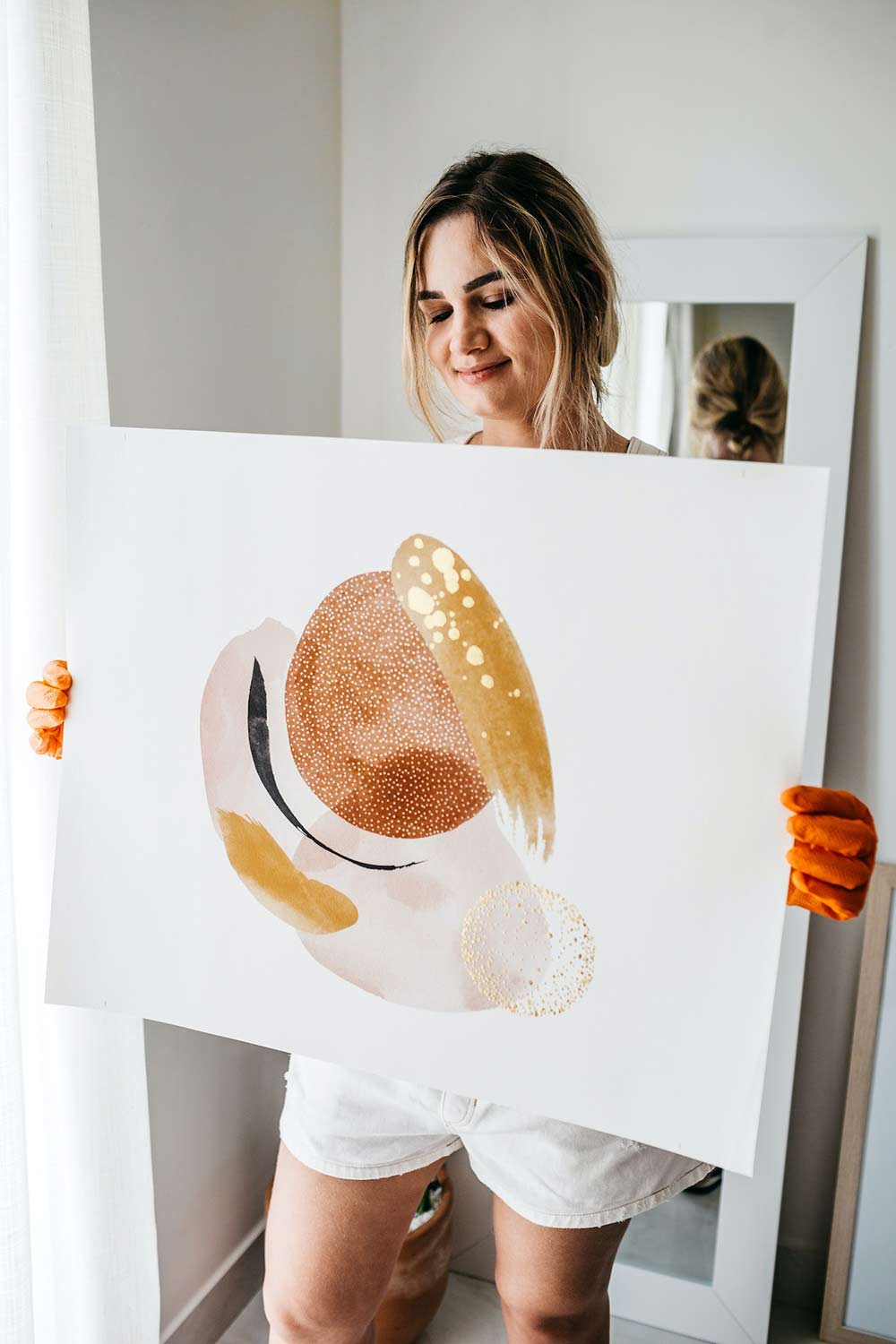 Woman holding art