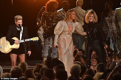 Beyonce steals the show in a low-cut sheer dress at the 50th Annual Country Music Association Awards