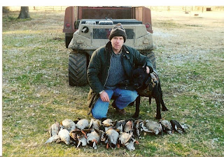 alt="North Texas Retriever Trainers dog with ducks"