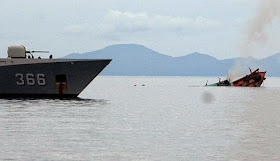 http://qz.com/346846/indonesia-is-sinking-illegal-fishing-boats-in-dramatic-fashion-and-may-be-killing-fish-in-the-process/