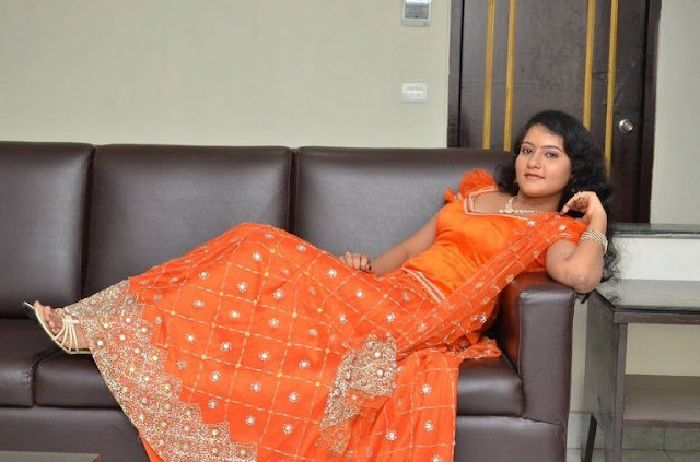 Akshara looking radiant in an orange puff-sleeved blouse and lehenga, blending tradition with modern style.