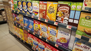 the cereal aisle in the food store at the nearby mall