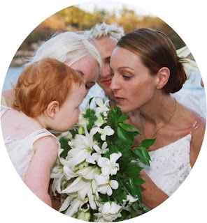 Married by Magnetic Island Celebrant Crusty Herron, smelling brides bouquet