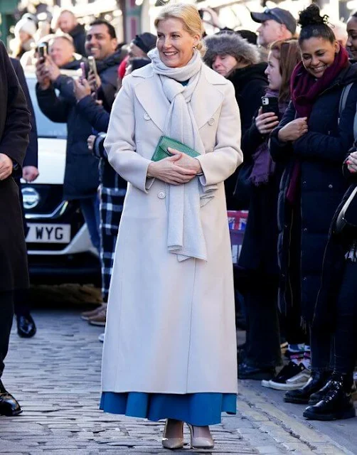 The Duchess of Edinburgh wore an Adele cape-sleeves crepe pleaded midi dress by Roksanda. Max Mara wool coat