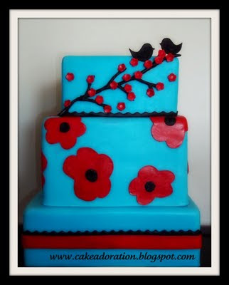 Blue and Red Modern Cherry Blossom Cake with two little love Birds on top