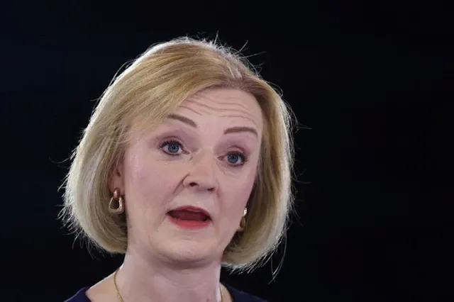 British ministers urge party to back under-fire premier