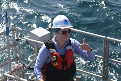 Intern Kaytlin Ingman giving thumbs up, on a boat, National Marine Sanctuaries, Public domain