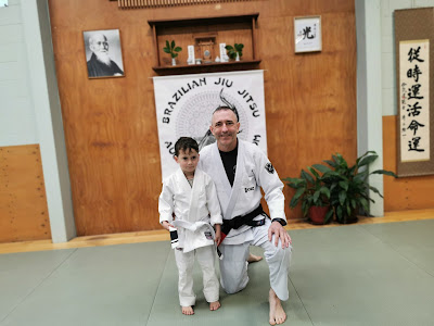 Professor Adam Evans with Theo Auckland Kids BJJ