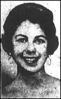 Headshot of a smiling young white woman with short, thick, dark hair