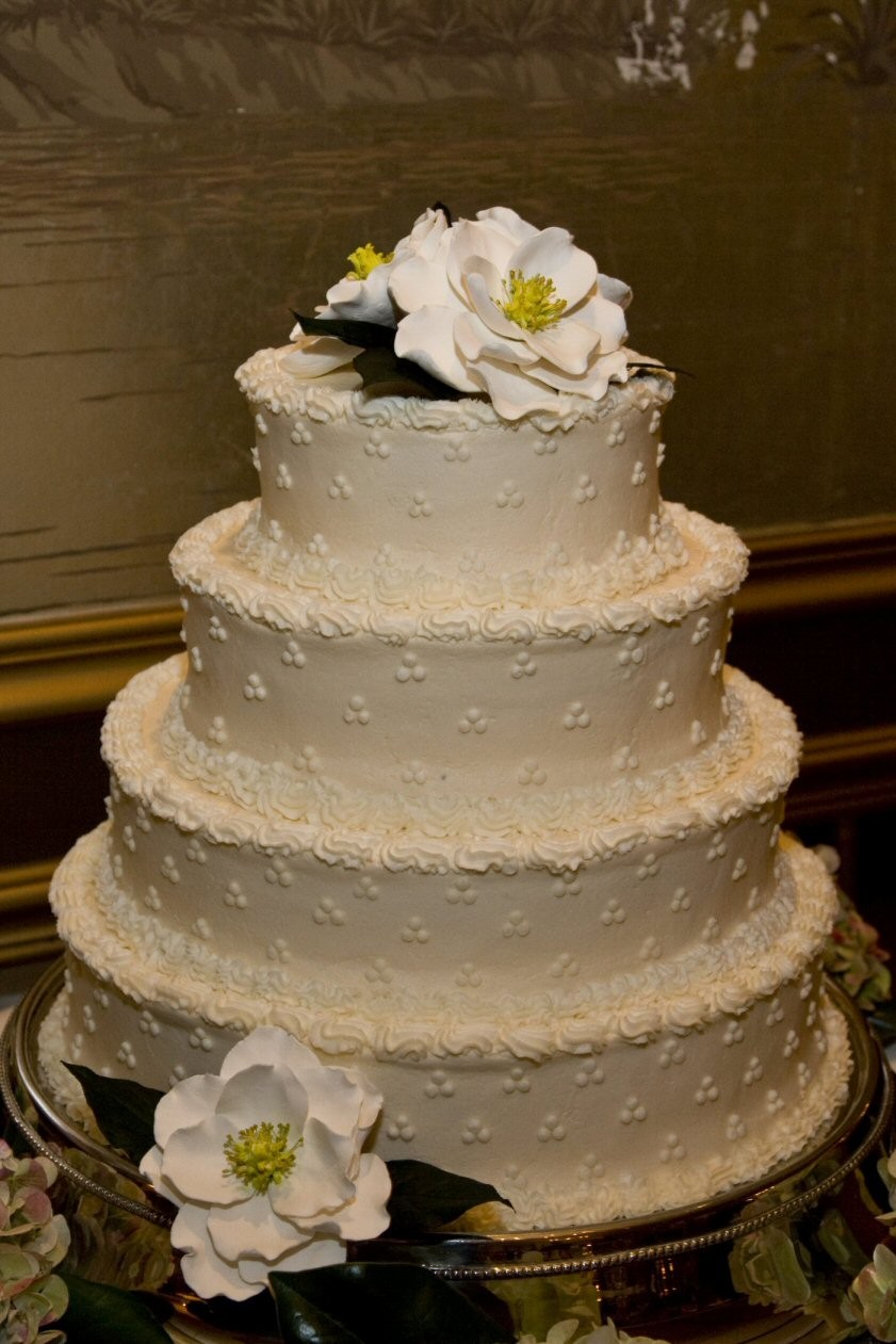 Wedding cake with brown magnolia flowers
