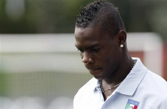 Italy striker Mario Balotelli admits he is unhappy and homesick living in Manchester