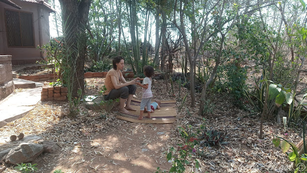 Nora, Nina, and Kathi in our front yard enjoying some sun.