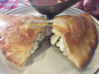 The cheesesteak calzone was stuffed with caramelized onions and three cheeses