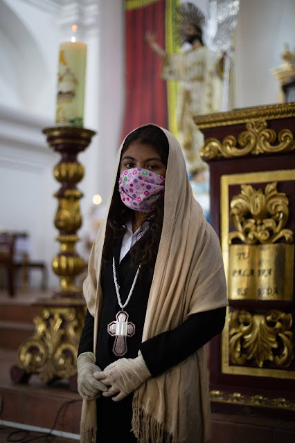 Guatemalan girl in mask and clothes at church in Antigua, Guatemala, CREDIT James Rodriguez