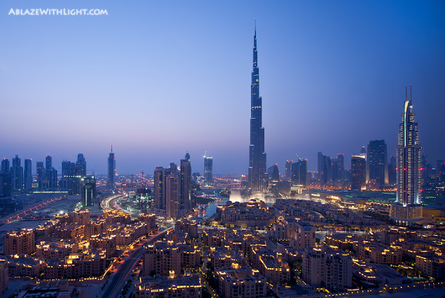 Photo of Burj Khalifa and other downtown lowrise buildings at sunset