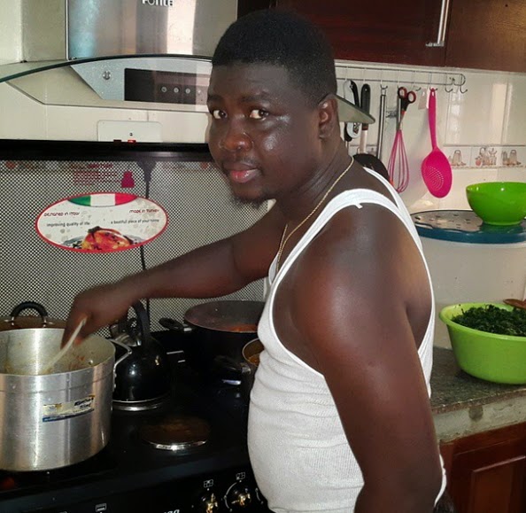 nigerian man cooking wife