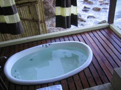 Outdoor jacuzzi with view on the sea surrounding gem island