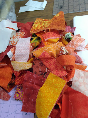 A pile of orange fabric scraps