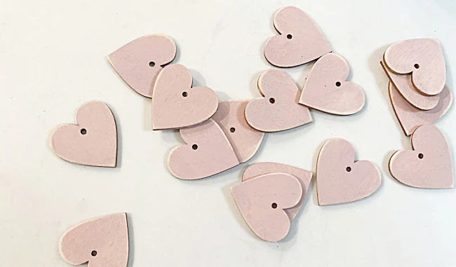 sanded pink hearts with a hole