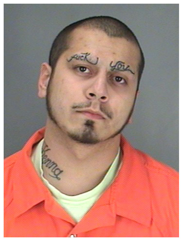 Suspect with 'FUCK YOU' tattooed across his forehead