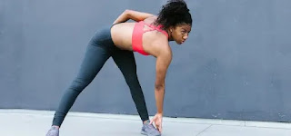 importance of exercise A female athlete stretches her body