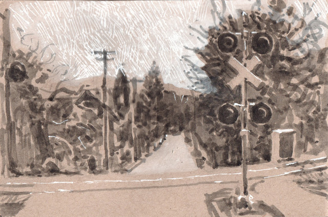 Ink on toned paper sketch of railroad crossing with signals, looking downhill at at church steeple, trees, and utility poles.