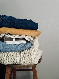 A stack of clothes on a stool