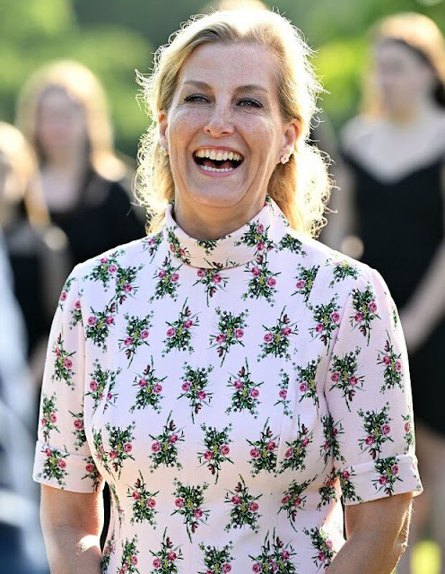 The Countess of Wessex wore a new bespoke floral print midi dress by Emilia Wickstead, and metallic fit-and-flare midi dress by Alaia