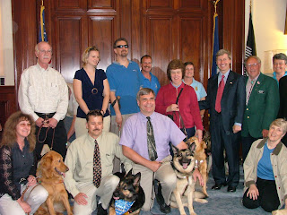 PHOTO OF THE DOG GUIDE USERS GROUP WITH GOVERNOR LYNCH
